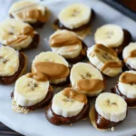 Sliced bananas topped with peanut butter